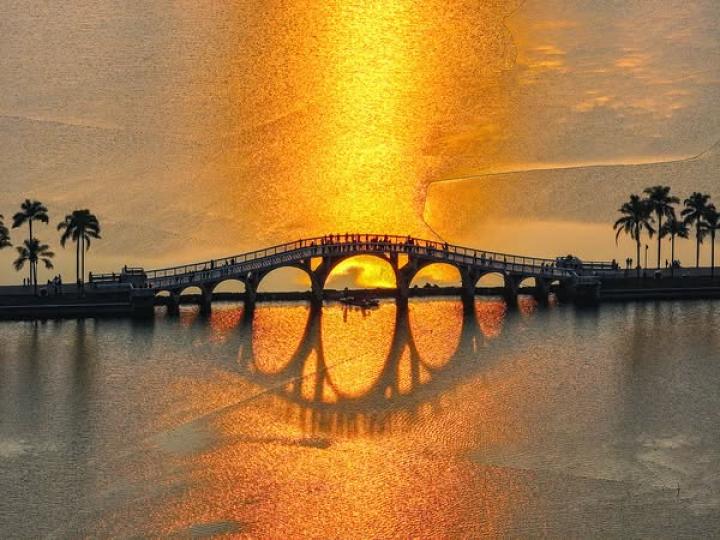 glows in the golden hues of the setting sun...