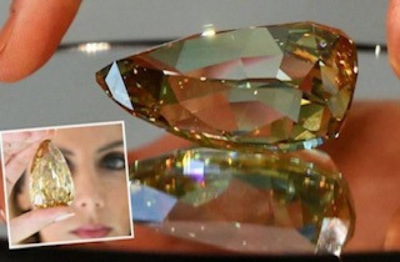 無暇黃鑽石
近日，一顆重達303.1克拉的梨形黃鑽在杜拜展出。這顆鑽石名為「金色金絲雀」，被美國寶石學院評定為現今全球最大的無暇鑽石，市場估價約為1300萬英鎊（約合人民幣1.06億元）。
這顆「金色...