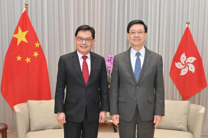 相見歡: 李家超(右)與王瑞杰會面。 相見歡: 李家超(右)與王瑞杰會面。