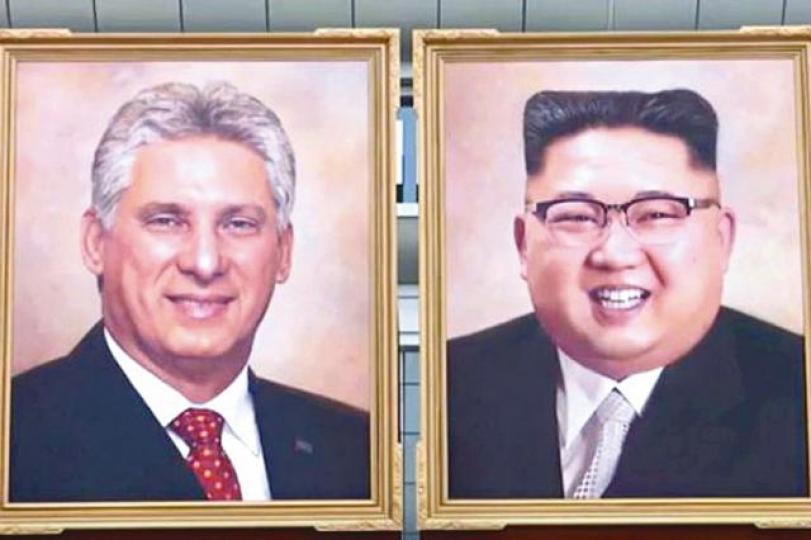 機場外掛有迪亞斯卡內爾及金正恩的官方肖像畫。古巴總統迪亞斯卡內爾出訪北韓與金正恩會面。路透社