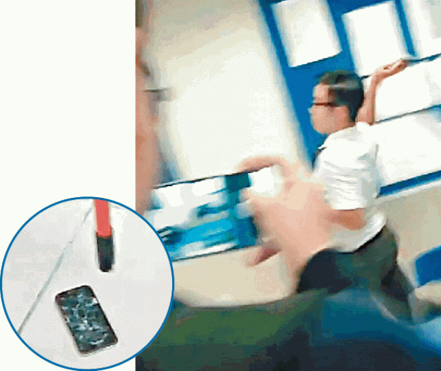 片中有學生將手機用力掟向牆,更用棍打至粉碎(圓圖)。 片中有學生將手機用力掟向牆,更用棍打至粉碎(圓圖)。